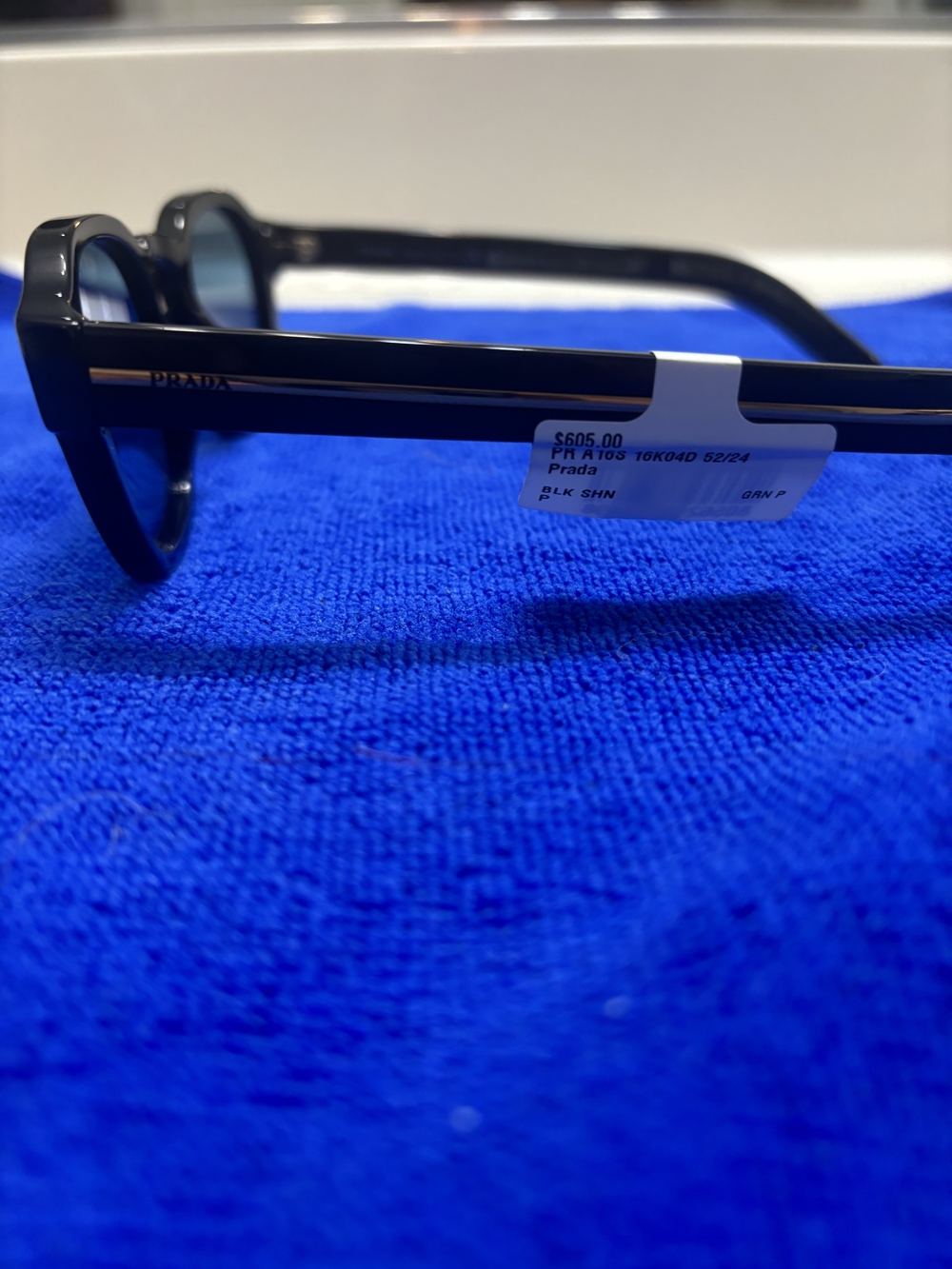 Prada Men’s Black Sunglasses with Gold Accent